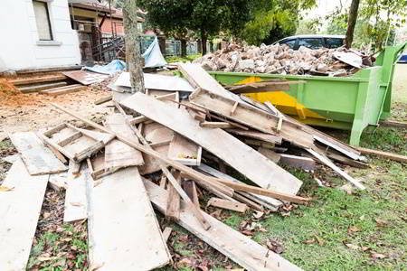 dumpster on construction site loaded with construction debris
