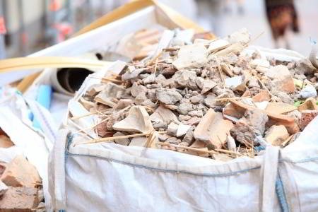 Construction waste debris bags full of bricks and demolition debris